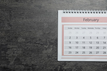 Wall Mural - February calendar on grey stone background, top view. Space for text