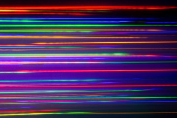 Wall Mural -  Stripes of different colored LED lights. Abstract colorful background. Red, green and blue color stripes combination.