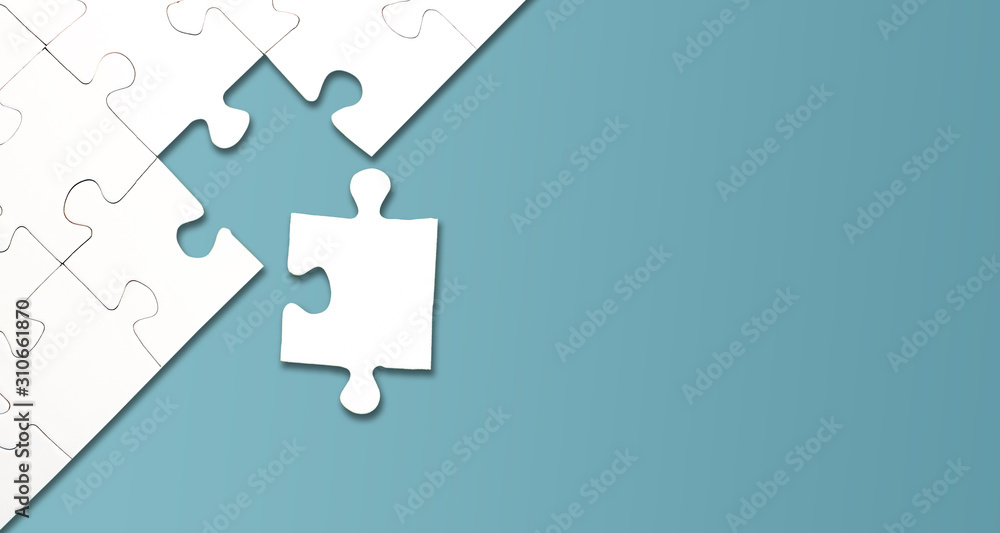 top view of jigsaw puzzle with one piece left on blue background, completing a task or solving a problem concept - obrazy, fototapety, plakaty 