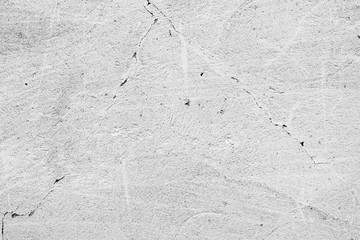 Texture of a concrete wall with cracks and scratches which can be used as a background