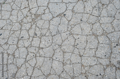 Fotomural Old road background - surface of grey cracked asphalt texture