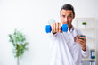 © Elnur - Young male doctor in sport and dieting concept