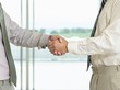 © MDBPIXS - Closeup Side View Of Business Handshake