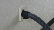 Central Vacuum Cleaner Hose Connected To The Wall