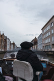 Fototapeta Młodzieżowe - old man on a boat in bruges