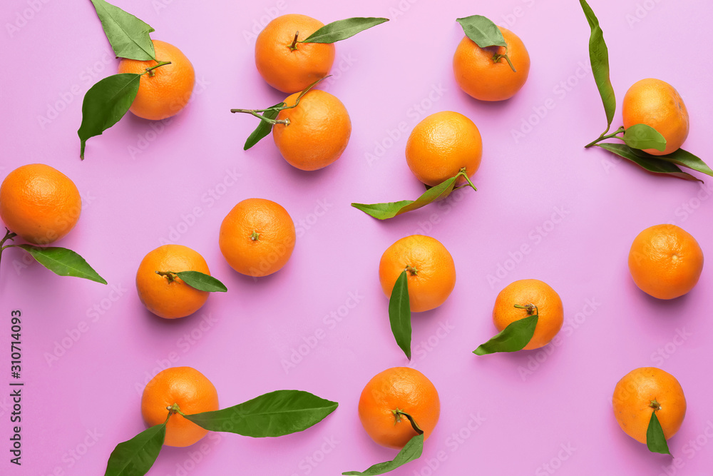Sweet tangerines on color background