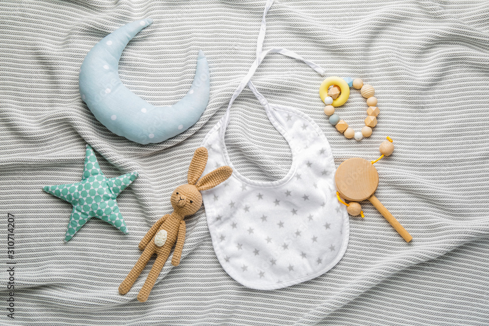 Baby toys and accessories on plaid