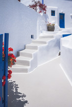 Greek Architecture With White Washed Walls And Blue Gates