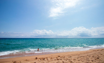 Caucasian boy playing on the beach