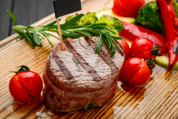 Canvas Print - Grilled bbq steak with potato cube and tomatoes.