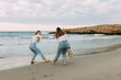 © Javier Pardina/Stocksy - two friends enjoying. at beach