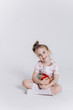 © Andreshkova Nastya - Close up portrait of little cute adorable girl posing alone on isolated white background in studio. Childhood, fashion kids, baby model concept
