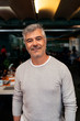 © Santi Nunez/Stocksy - Portrait of businessman