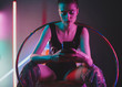 © AD Photography/Stocksy - Portrait Of Young Female Woman In Room With Neon Lights