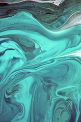  Abstract created using the technique of liquid acrylic. Macro photography of the smallest details of a panting. The panting shows how overflows of shades and colors of paint resemble space motifs.