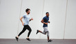 © Bonninstudio/Stocksy - Athletes training on the street.