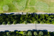 © Lawren Lu/Stocksy - Aerial view of the golf course and surrounding roads
