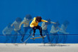 © guille Faingold/Stocksy - Ethnic man doing skateboard jump