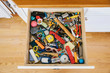 © Raymond Forbes LLC/Stocksy - Utility Drawer at home with Hammer