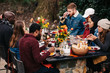 © CWP, LLC/Stocksy - Group of friends enjoy fall dinner party