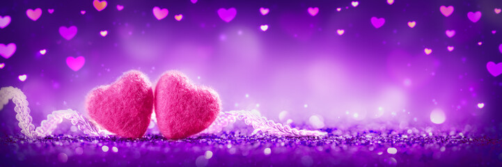 Wall Mural - two soft pink hearts with lace on purple glitter background - valentine's day concept