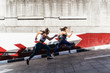© Santi Nunez/Stocksy - Professional Runners in the street