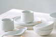 © Maki Company Limited/Stocksy - Set of white minimal tableware.