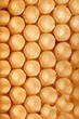 © Yaroslav Danylchenko/Stocksy - Background made of wax honeycomb filled with organic honey. Macro photo. Flat lay