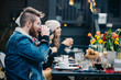 © CWP, LLC/Stocksy - Man taking a drink with friends