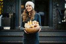 Party Hostess Delivering A Bread Bowl