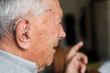 © Jovana Milanko/Stocksy - Senior man wearing hearing aid tool