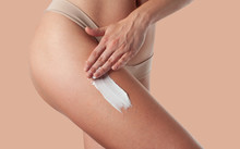 Body Care. Woman Applying Anti Cellulite Cream On Legs.