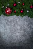 Fototapeta Desenie - Christmas background with White and red ornaments, festive decor, fir tree branches on gray granite .