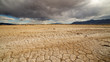 © Wesley Aston - Low clouds over dry cracked desert in Utah in the West Desert near Fish Springs.
