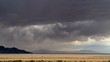 © Wesley Aston - Storm dumping rain on the dry desert in Utah over the Bonneville Salt Flats near Fish Springs.