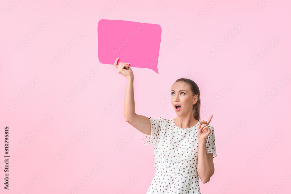 Young woman with blank speech bubble and raised index finger on color background