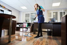 Cleaning Service. Wiping Office Floor With Mop