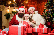 Love And Kindness. Gifts From Santa. Lovely Daughter With Parents. Christmas Traditions Concept. Father Santa Claus Costume With Family Celebrating Christmas. Christmas Is The Time To Please