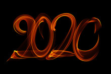 Happy New Year 2020 Isolated Numbers Lettering Written With Fire Flame Or Smoke On Black Background