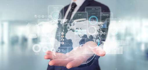 Wall Mural - businessman holding user interface screens with icon, stats and data 3d rendering