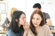 © suchalinee - two women gossip people at the office