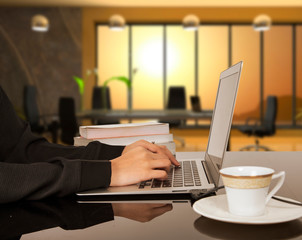 Woman hands typing on laptop keyboard at the office, Woman worker and business concept.