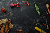 Fototapeta Boho - Old kitchen background with spices and vegetables. Top view. Free copy space.