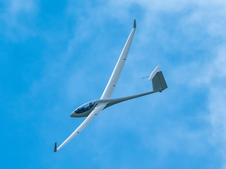 Wall Mural - Glider plane flying in the clouds