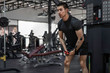 © aumnat - athletic man doing chest exercise using cable crossover machine gym sports fitness motivation strength concept