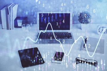 Forex market chart hologram and personal computer background. Multi exposure. Concept of investment.