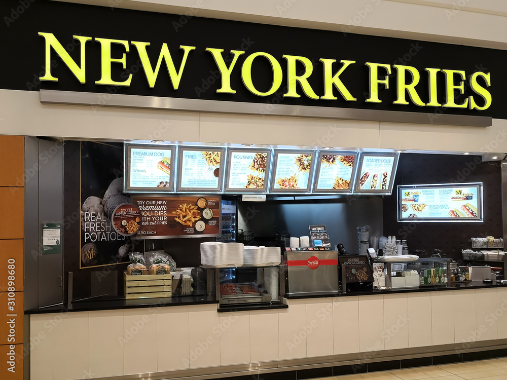 Richmond Hill, Ontario, Canada - May 04, 2019: New York Fries booth in the food court at Hillcrest mall in Richmond Hill, Ontario, Canada, a Canadian quick service restaurant. 