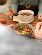 Close-up of healthy bowls on wooden table in cozy café