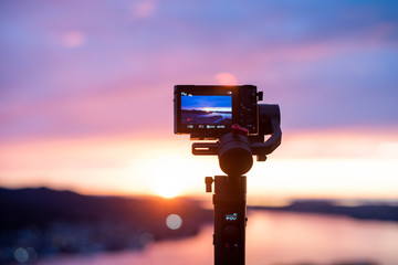 Camera on stabilizer is recording beautiful view at twilight