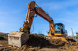 Constuction industry heavy equipment yellow Excavator at Construction Site